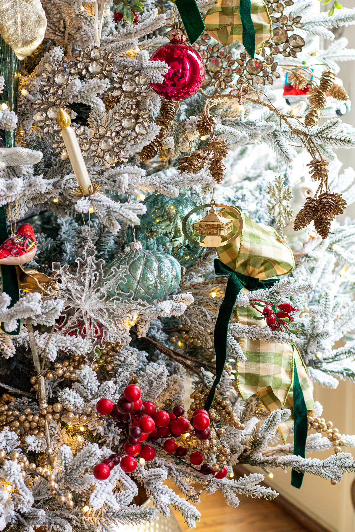 glass ornaments on a flocked Christmas tree