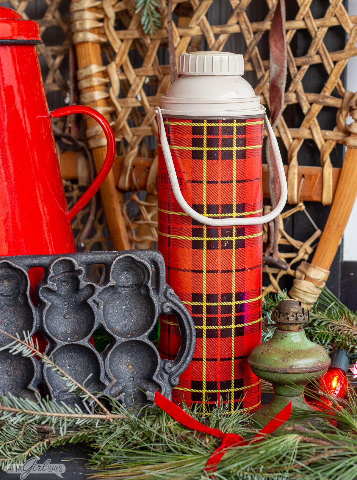cast iron snowman pan with a plaid Thermos