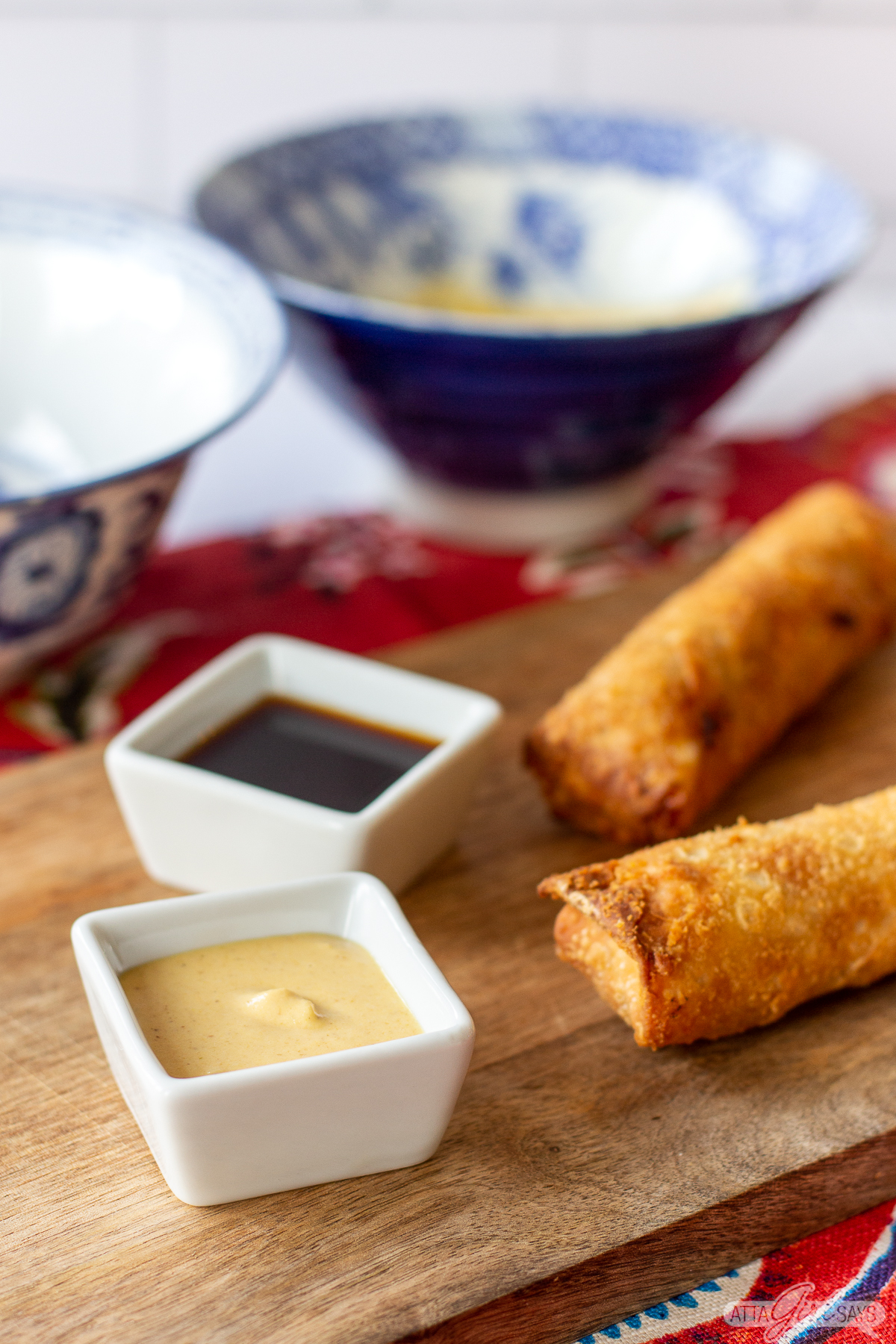 fried eggrolls with Chinese hot mustard and soy sauce in square bowls