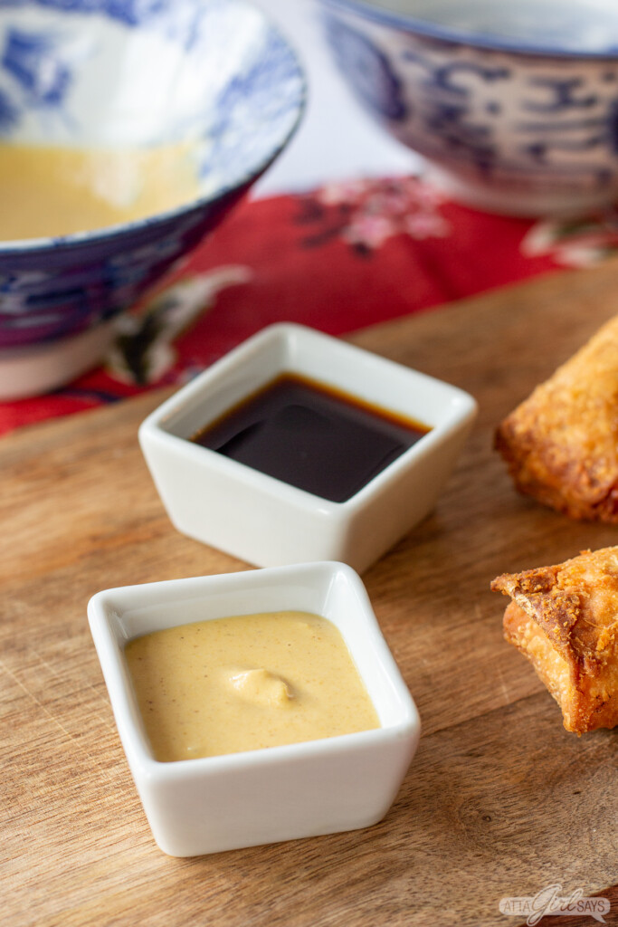 Chinese hot ustard and soy sauce in square bowls