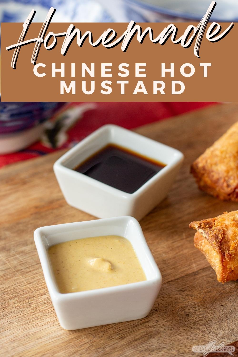 bowls of soy sauce and Chinese mustard with egg rolls