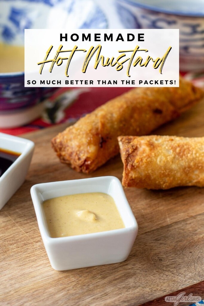 bowls of soy sauce and Chinese mustard with egg rolls