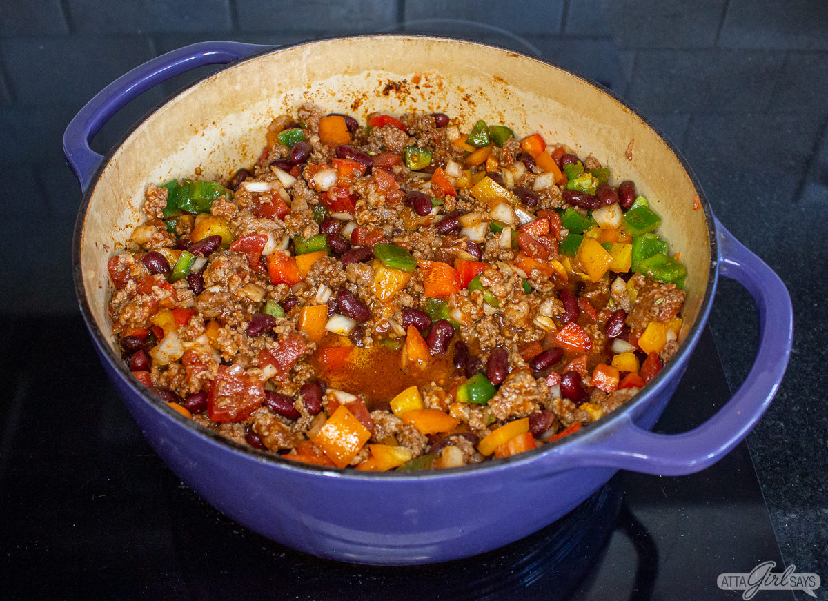 chili wih beans and peppers cooking on the stovetop
