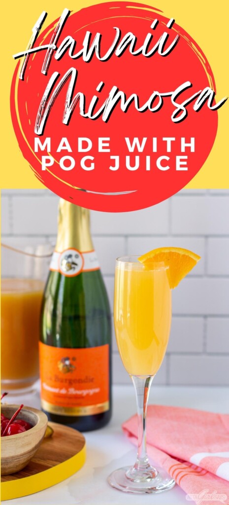 bottle of champagne with an orange cocktail in a champagne flute