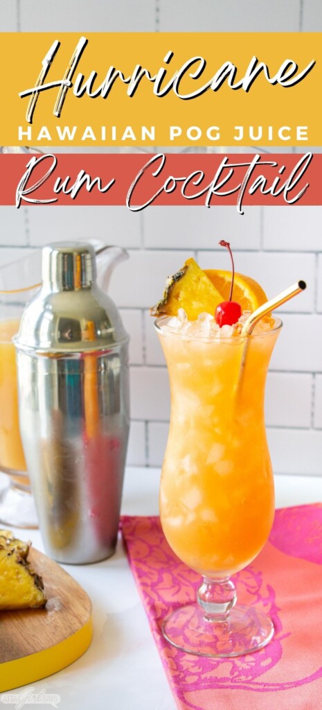 cocktail shaker and a Hurricane cocktail on a pink cloth with pineapple slices on a cutting board
