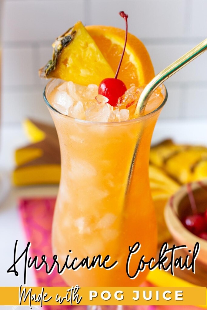 hurricane cocktail in a glass with orange slice, pineapple slice and cherry