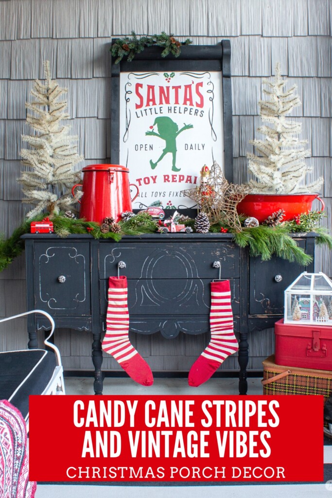 black buffet decorated for Christmas on a front porch