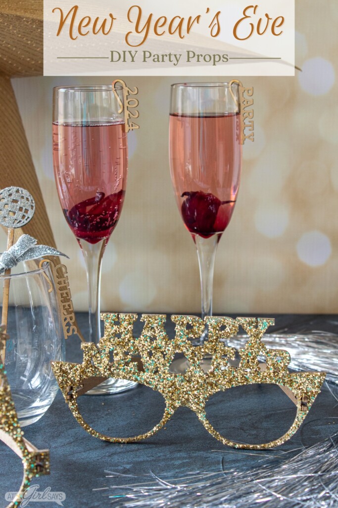 champagne flutes and a pair of glittered novelty New Year's Eve eyeglasses