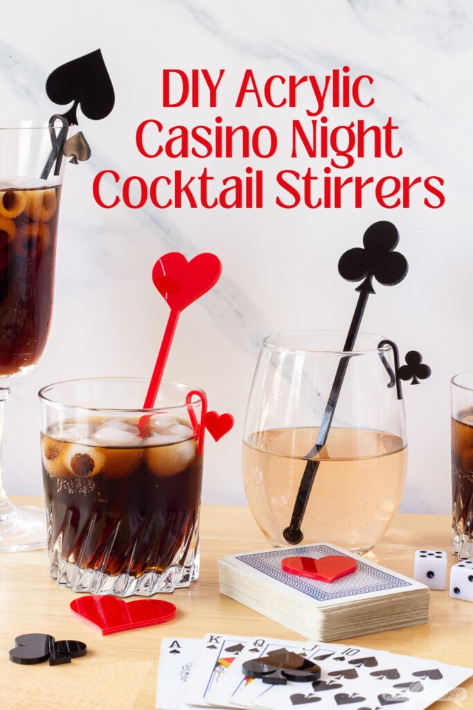 cocktail and wine glasses with acrylic stirrers and glass markers on a table with playing cards