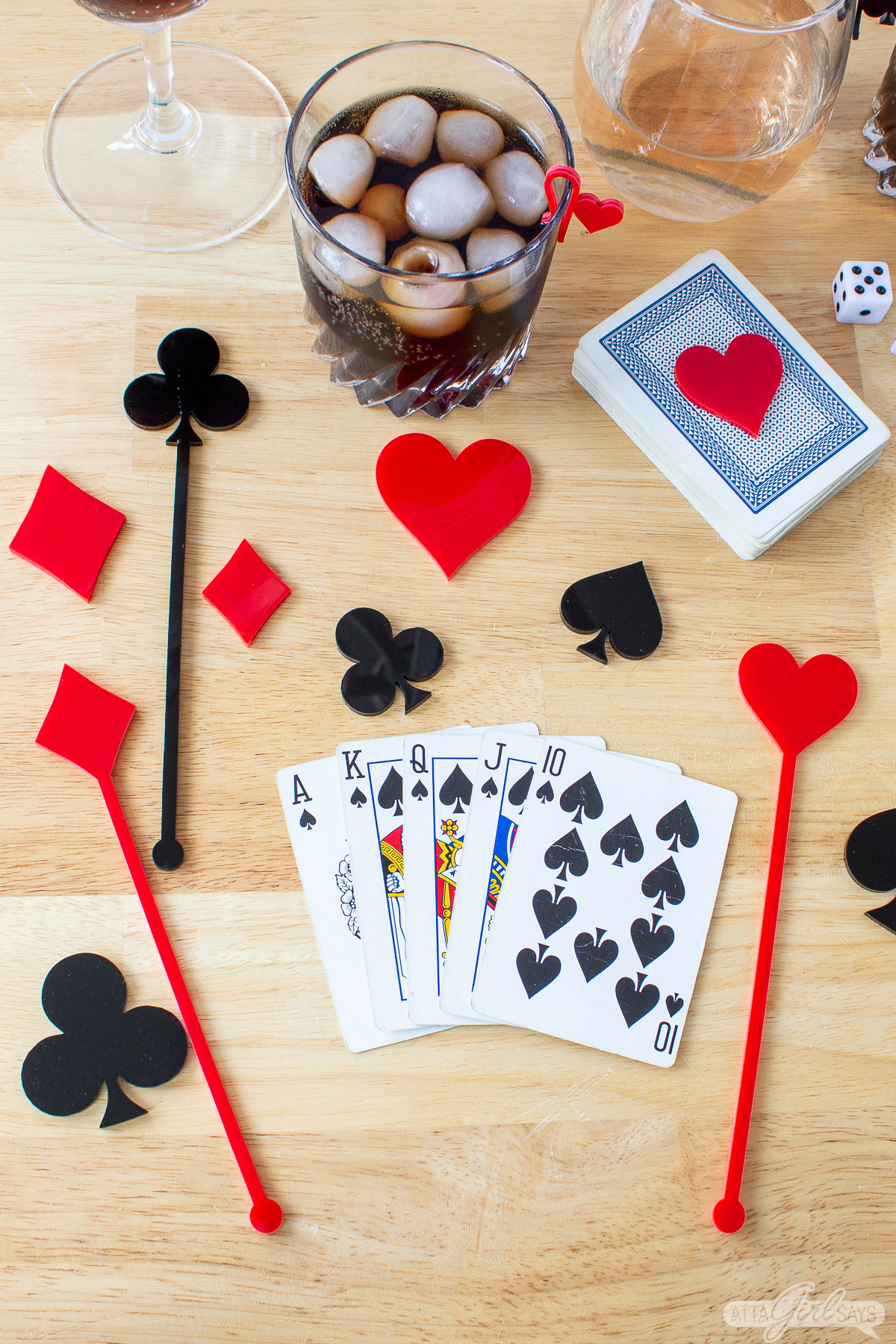 Royal straight flush playing card hand with acrylic swizzle sticks and card markers
