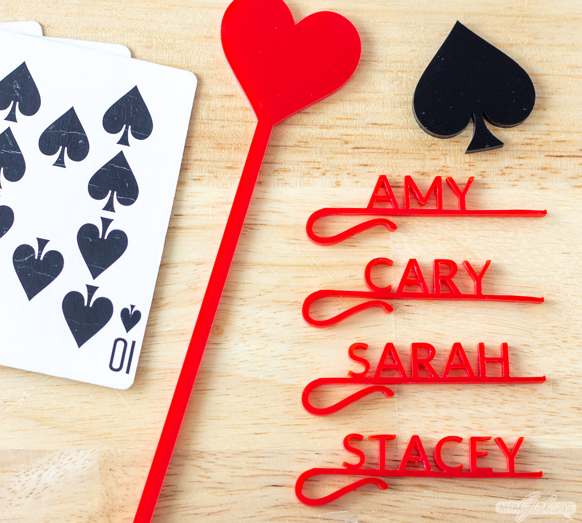 personalized acrylic wine glass charms and swizzle sticks with a playing card