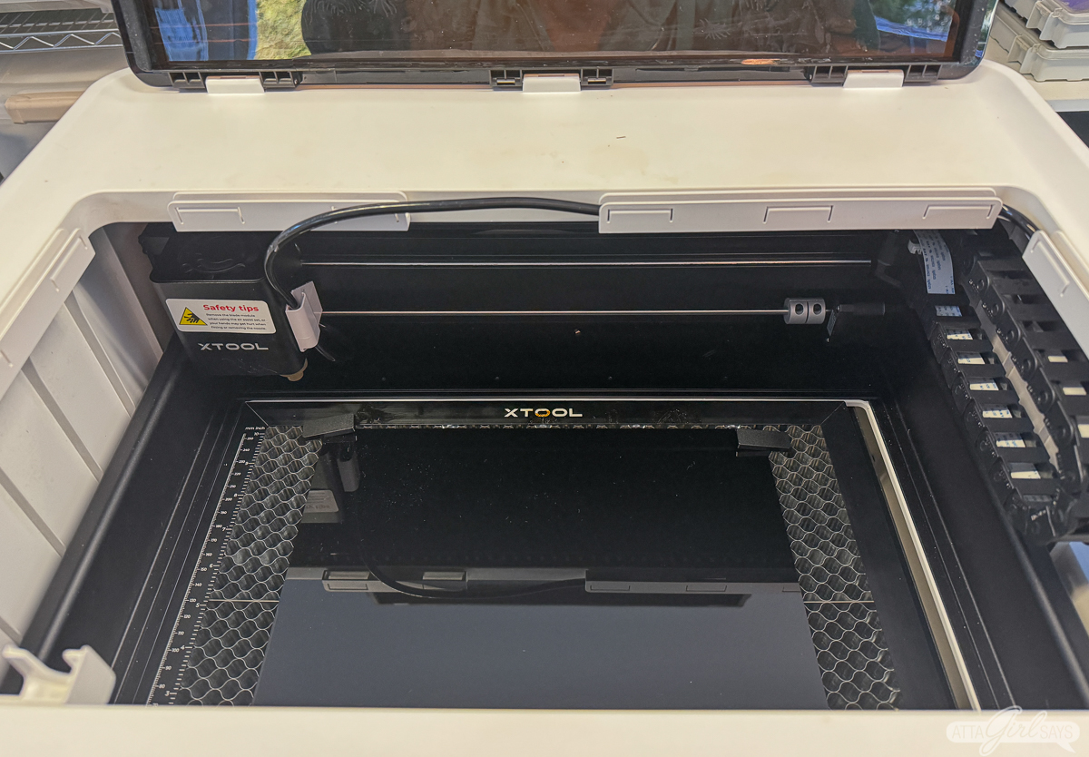 black acrylic sheet on honeycomb panel in xTool M1 laser cutter