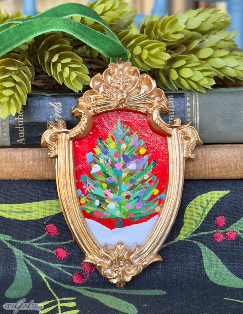 impressionistic Christmas tree painting in a gold ornament frame