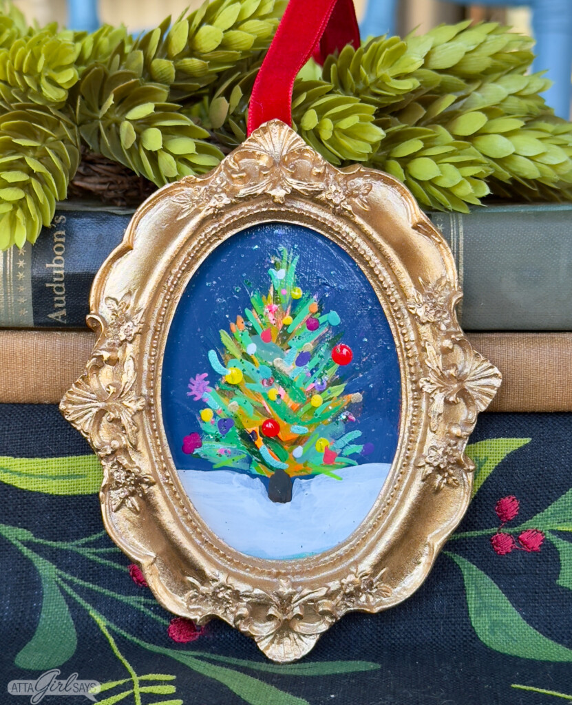 miniature Christmas tree painting in a gold frame