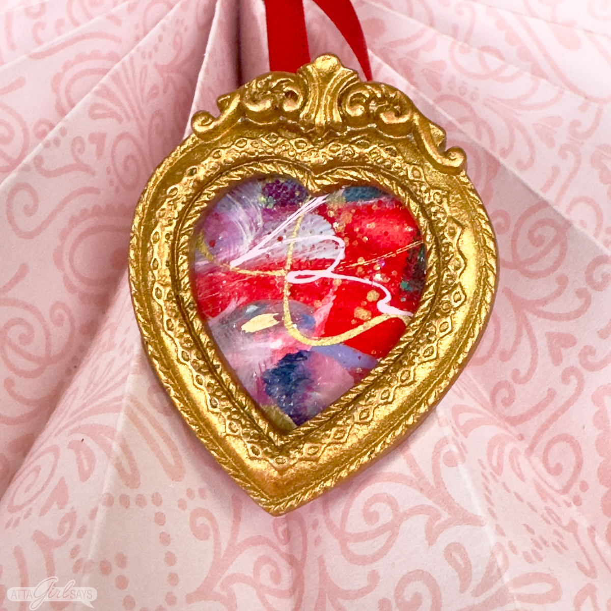 mini heart painting in gold heart-shaped resin frame